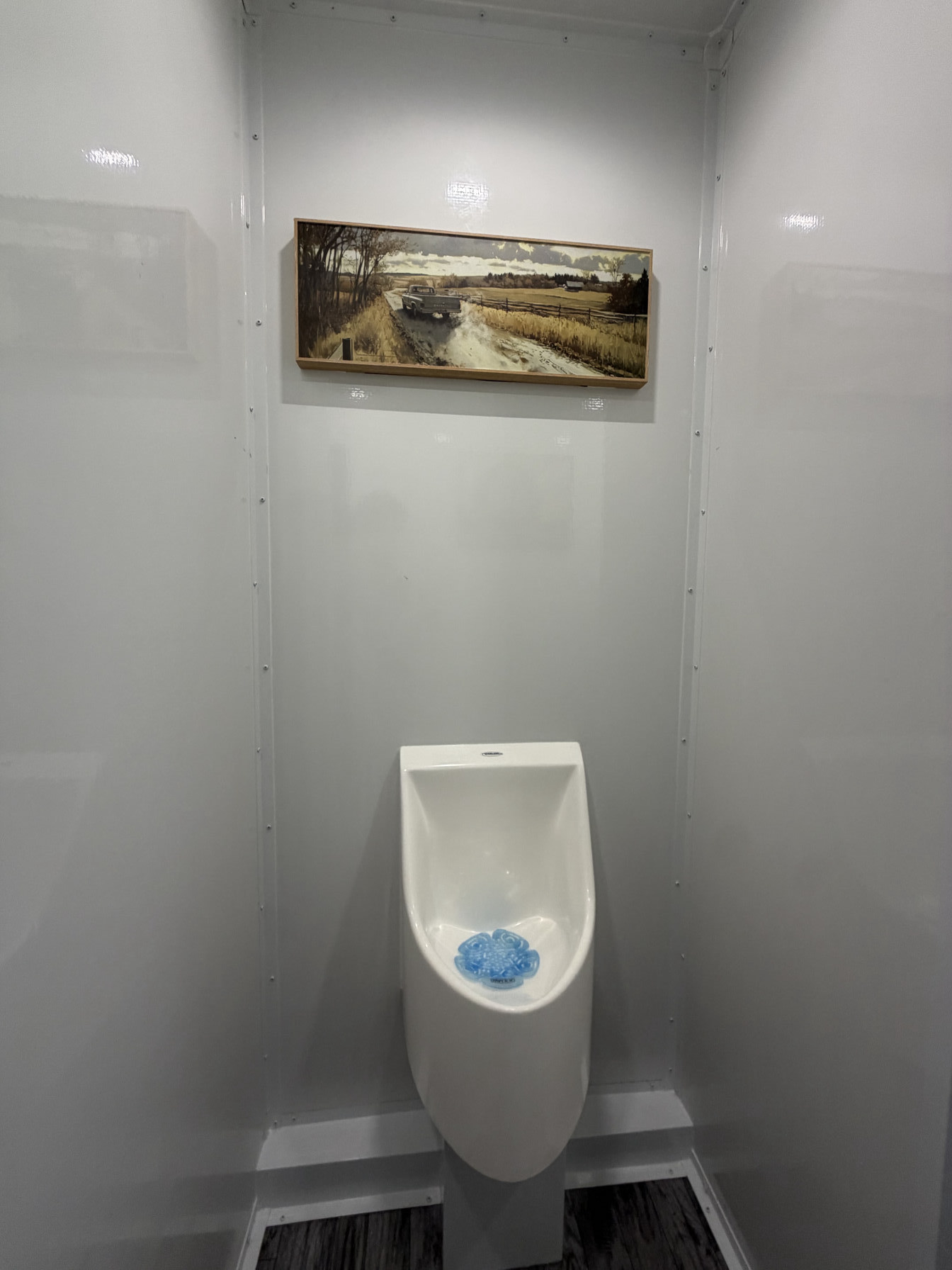 Men’s restroom station with urinal in luxury restroom trailer